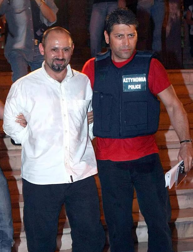 Greeces Robin Hood pictured being taken to court in Thessaloniki in 2008Credit: Rex